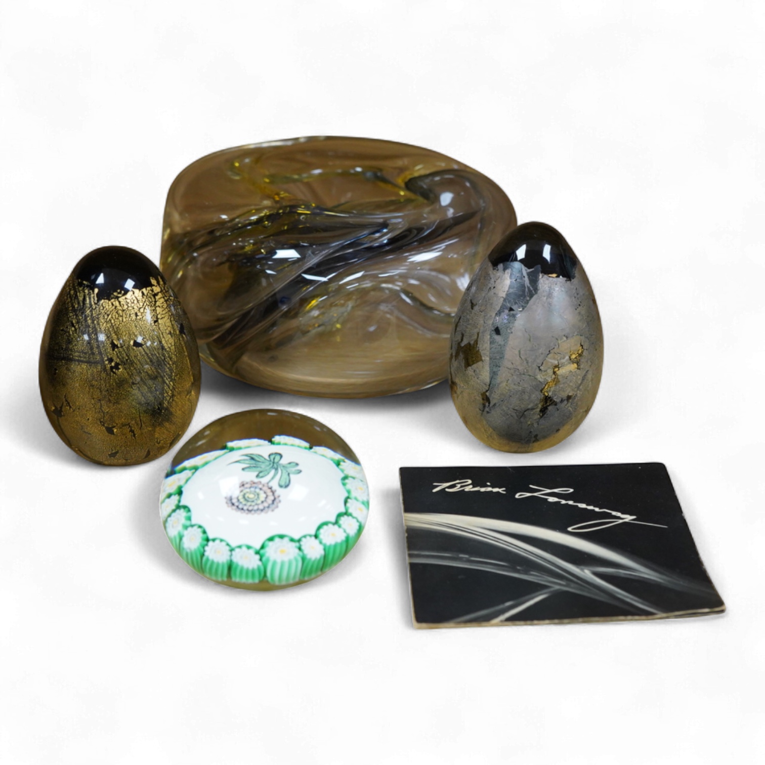 Brian Lonsway (American), an art glass ornamental dish, two Isle of Wight glass eggs and a floral paperweight, tallest 8.5cm